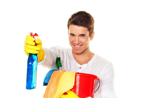Professional carpet cleaning team following safe working standards